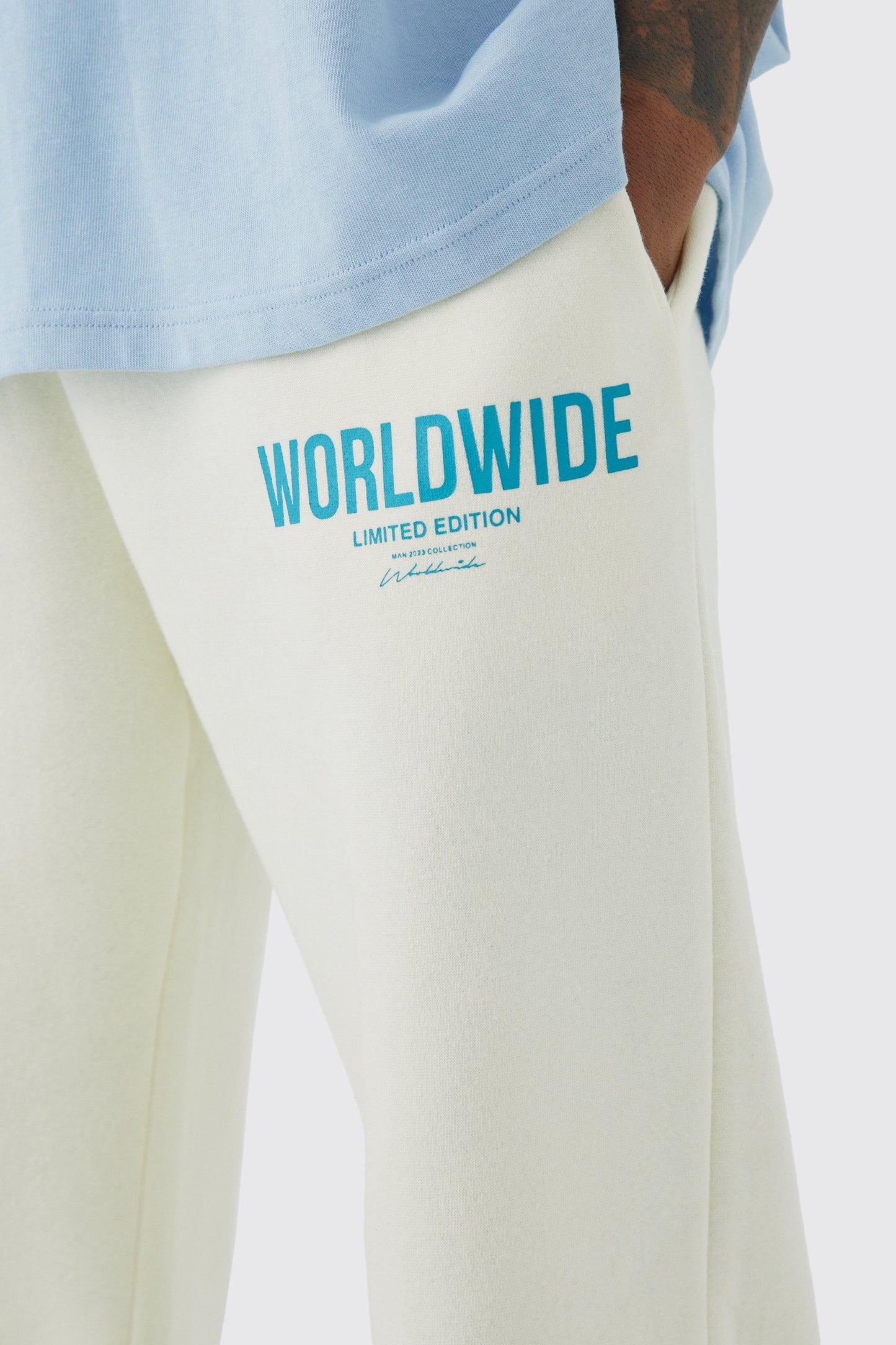 SPLIT HEM WORLDWIDE TEXT PRINT JOGGER